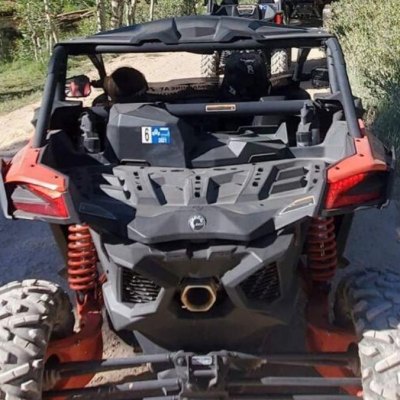 a person riding on the back of a truck